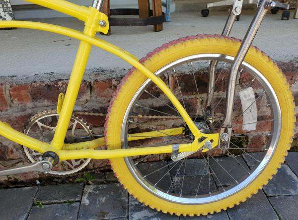 Yellow bike over the wall