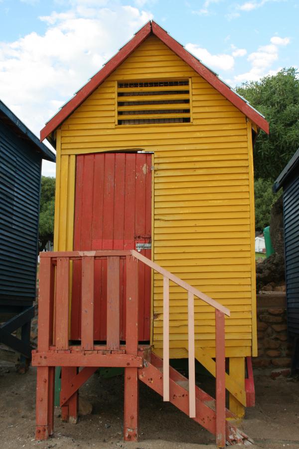 Yellow cabin on the beach.