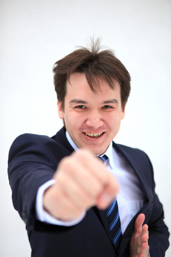 young business man fighting with you