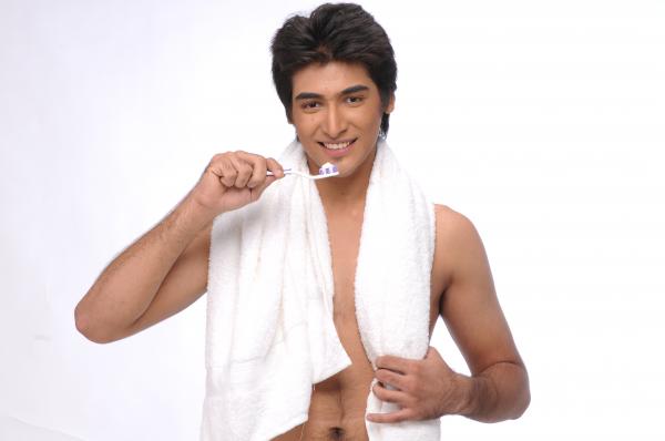 young man Brushing teeth