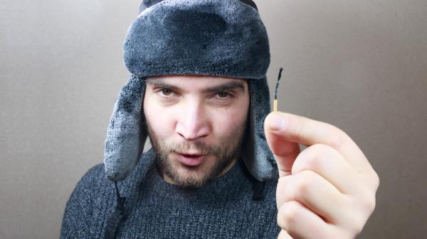 Young man holding a match