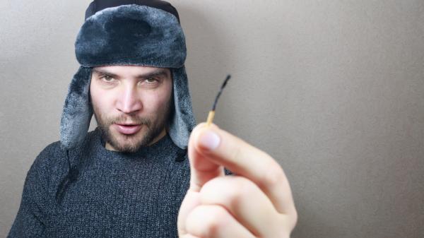 Young man holding a match
