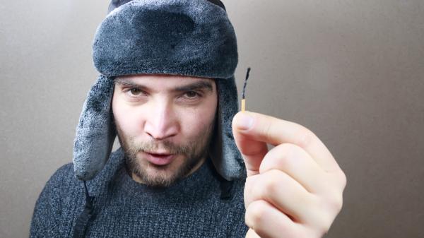 Young man holding a match