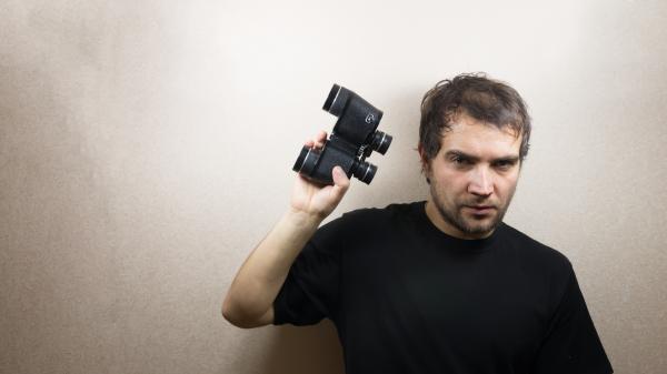 young man with binoculars