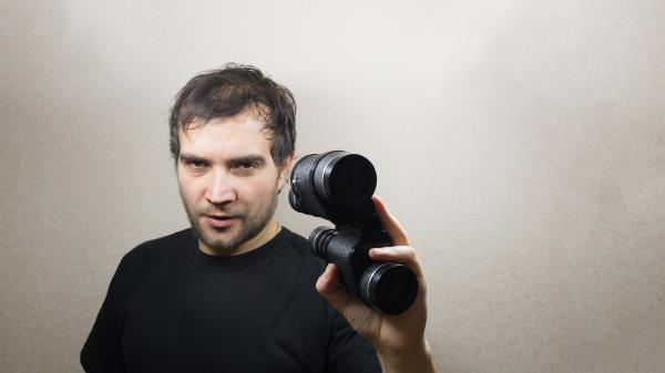 young man with binoculars