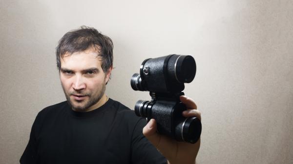 young man with binoculars