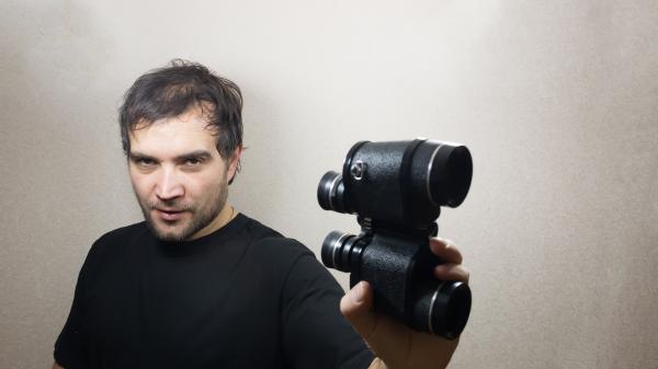 young man with binoculars
