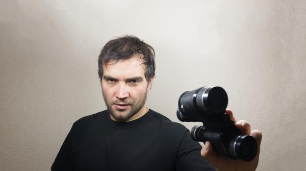 young man with binoculars